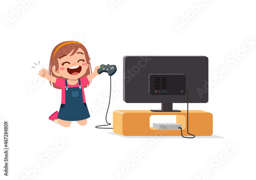 cute little girl play video game on big screen