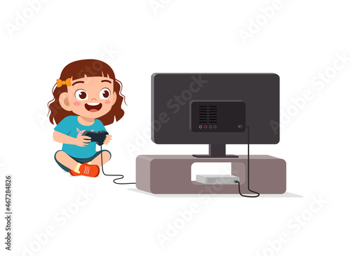 cute little girl play video game on big screen