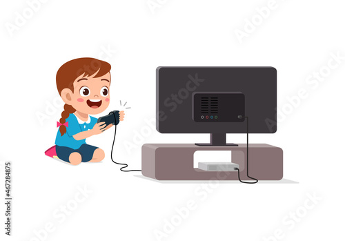 cute little girl play video game on big screen