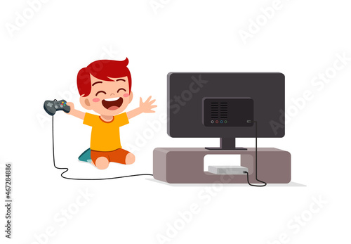 cute little boy play video game on big screen