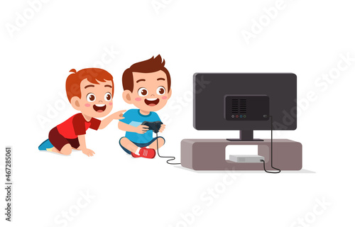 cute little boy play video game on big screen