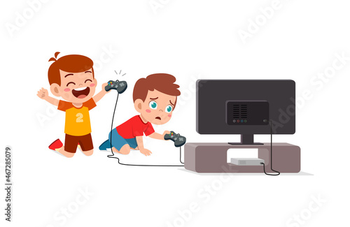 cute little boy play video game on big screen