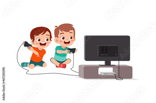 cute little boy play video game on big screen