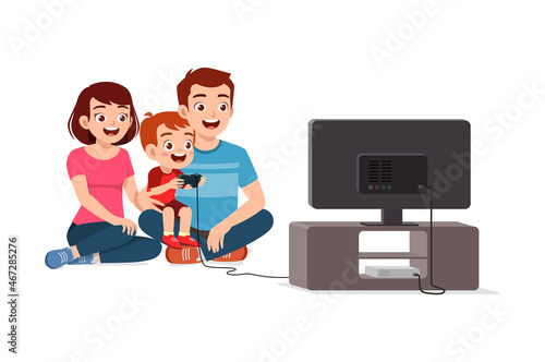 cute little boy play video game on big screen