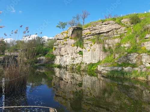 High stone, granite walls of the Buky canyon on the Hirsky Tikich river on a sunny day. Buky village, Cherkasy region, Ukraine