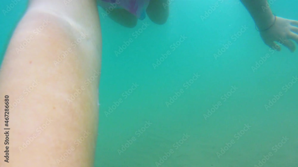 Little redhead child girl have fun exploring underwater environment with snorkel and diving mask Little redhead child girl have fun exploring underwater environment with snorkel and diving mask