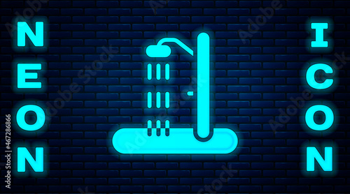 Glowing neon Beach shower icon isolated on brick wall background. Vector