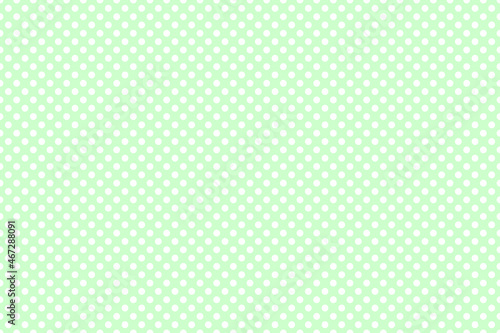 white polka dot abstract wallpaper on light green cream background