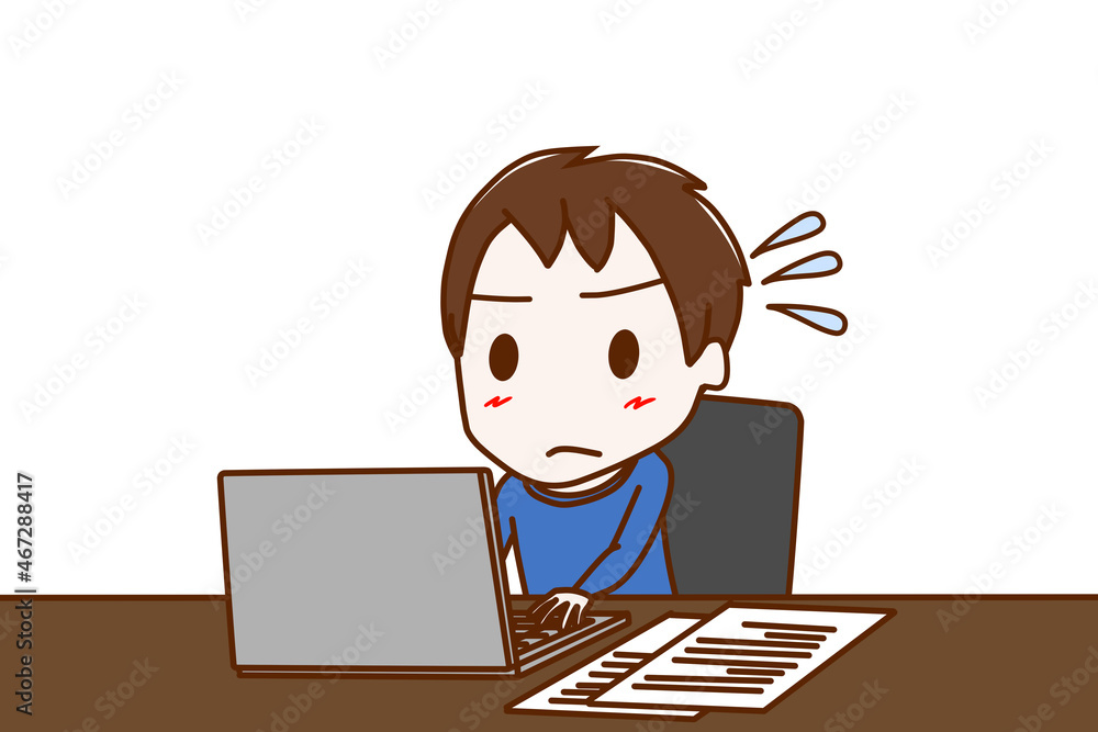座ってパソコンで書類作成に追われ焦っている少年 座ってパソコンで書類作成に追われ焦っている少年