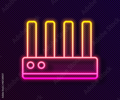 Glowing neon line Router and wi-fi signal icon isolated on black background. Wireless ethernet modem router. Computer technology internet. Vector
