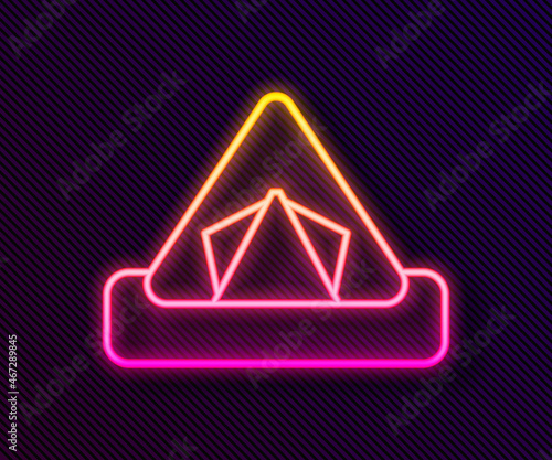 Glowing neon line Tourist tent icon isolated on black background. Camping symbol. Vector