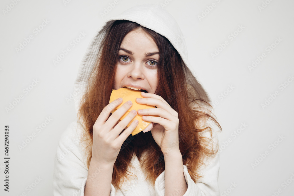 red-haired woman eating a sandwich snack lunch red-haired woman eating a sandwich snack lunch