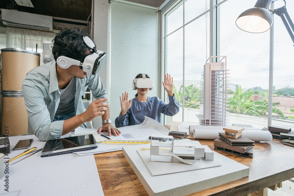 Team Architect or Engineer designer wearing VR headset for BIM technology working together design 3D model building in office. Technology futuristic virtual reality design. - obrazy, fototapety, plakaty 