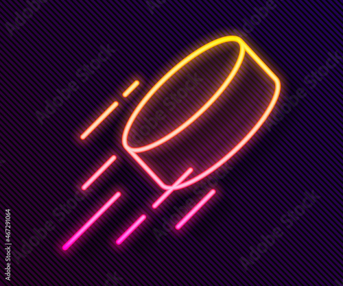 Glowing neon line Hockey puck icon isolated on black background. Vector