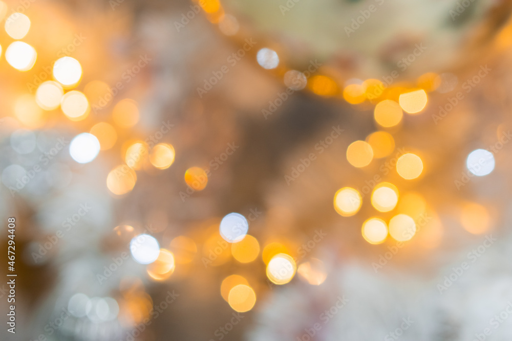 Blurry New Year and Christmas lights. New Year and Christmas festive bokeh. Abstract background