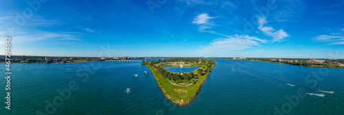 Looking towards the East, this aerial panoramic view shows the Western tip of Belle Isle below while showing Windsor, Ontario on the right and Detroit, Michigan on the left.  photo