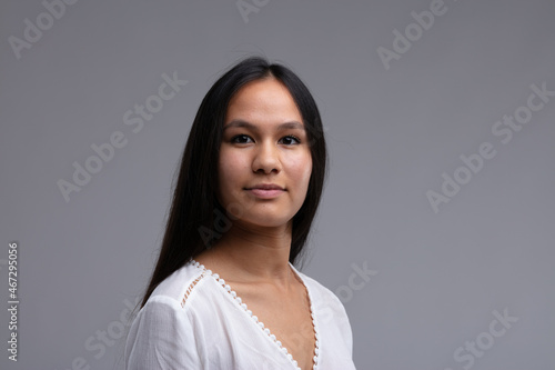 Фотография Portrait of a young woman with long straight dark hair