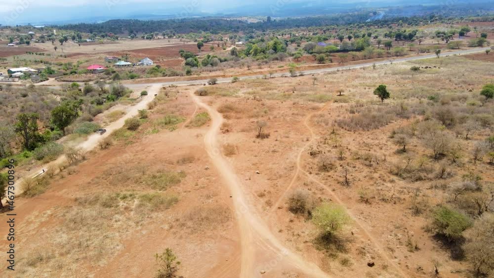 Aerial reveal of asphalt roads in a beautiful rural landscape in Kenya Aerial reveal of asphalt roads in a beautiful rural landscape in Kenya