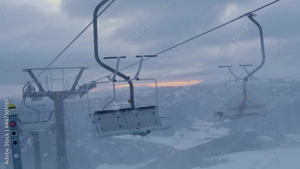 Timelapse of clouds during sunrise. Skilift in the foreground. Shot in Salzburg, Austria. Timelapse of clouds during sunrise. Skilift in the foreground. Shot in Salzburg, Austria.