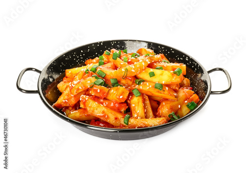Dish with honey chilli potato on white background