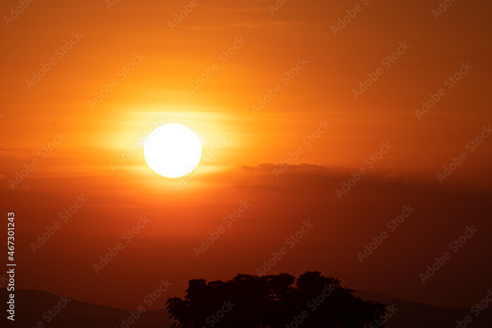 Beautiful sunset sky above clouds. orange sunset sky. Beautiful sky.Dramatic red yellow sunset over the forest Beautiful sunset sky above clouds. orange sunset sky. Beautiful sky.Dramatic red yellow sunset over the forest