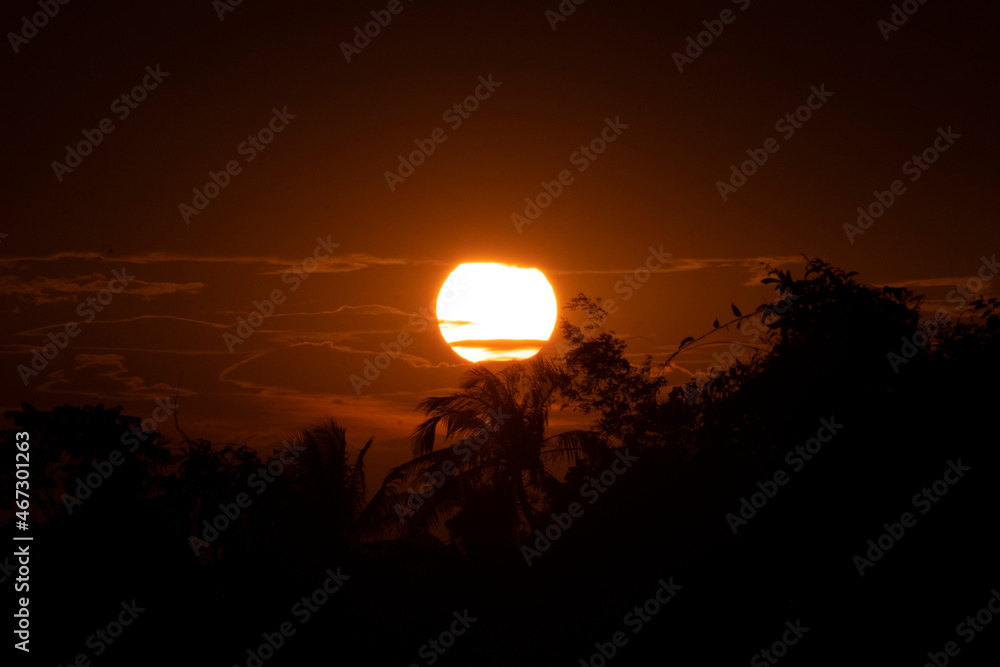 Obraz premium Beautiful sunset sky above clouds. orange sunset sky. Beautiful sky.Dramatic red yellow sunset over the forest
