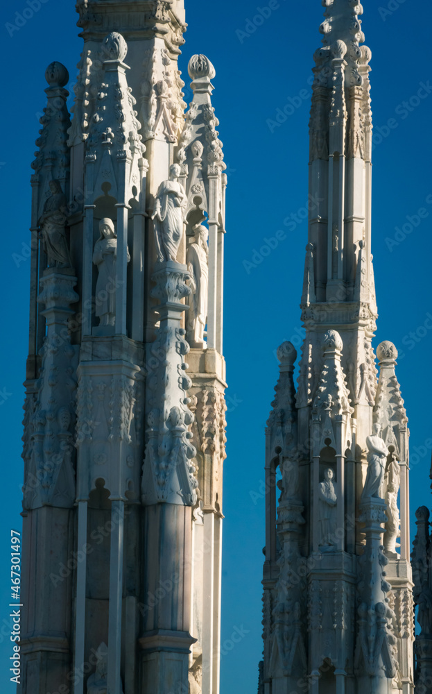 Sculptures of Milan Duomo Cathedral against the sky