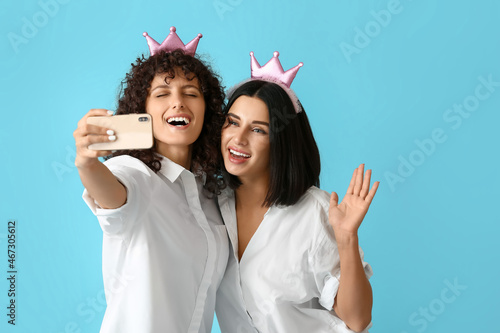 Happy sisters with toy crow...
