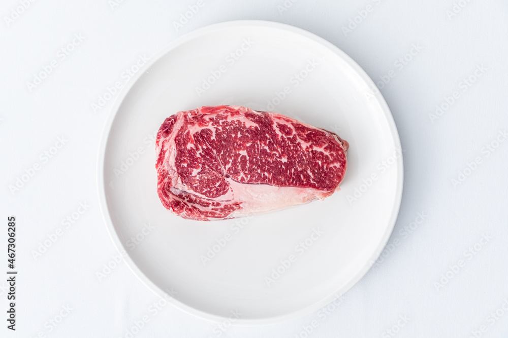 Raw fresh grilled sliced beef prime rib steak with marbling grain