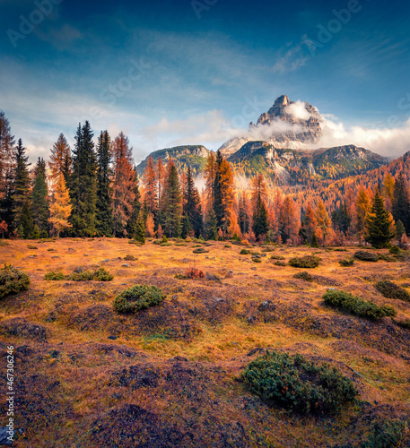 Colorful outdoor scene of Tre Chime Di Lavaredo National Park, Antorno lake location. Stunning autumn landscape of Dolomiti Alps, Italy, Europe. Beauty of nature concept background.