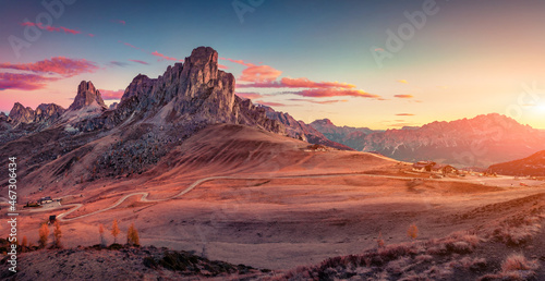 Panoramic morning view from the top of Giau pass of famous Ra Gusela summit. Picturesque autumn sunrise in Dolomite Alps, Cortina d'Ampezzo location, Italy, Europe. Beautiful autumn scenery..