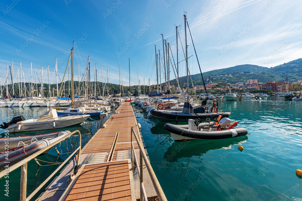 Port with many recreational boats moored, small Lerici town, tourist resort on the coast of the Gulf of La Spezia, Mediterranean sea, Liguria, Italy, Southern Europe.