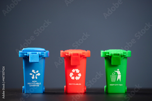 Fotografie Set of bins for the selective collection of waste (glass, paper, metal and plast