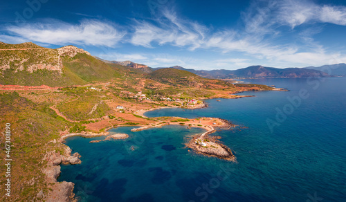 Colorful summer view from flying drone of Saint Phocas church. Wonderful outdoor scene of Peloponnese peninsula with deep blue sky, Greece, Europe. Beautiful summer seascape of Mediterranean Sea.