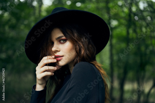 woman dressed as a witch in the forest Halloween fantasy ritual © VICHIZH