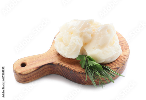 Board with lard and herbs on white background photo