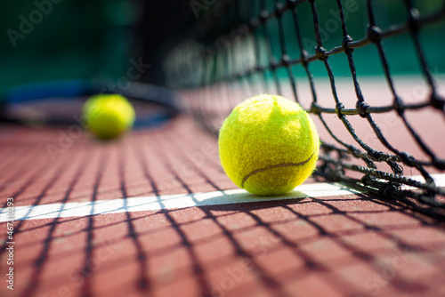 Tennis ball lying on the court. Healthy lifestyle concept © Dmytro_Mykhailov