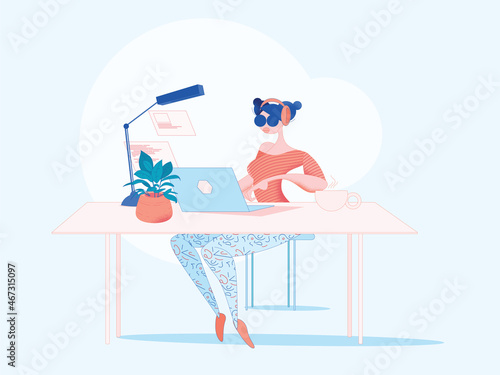 Digital freelancer woman with earphones works in a nicely decorated modern office on a  laptop