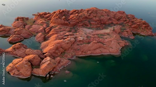 Sand Hollow State Park, Utah, USA. Beautiful aerial panning shot of Sand Hollow water reservoir and red sandstone. Establishing shot of the area. photo