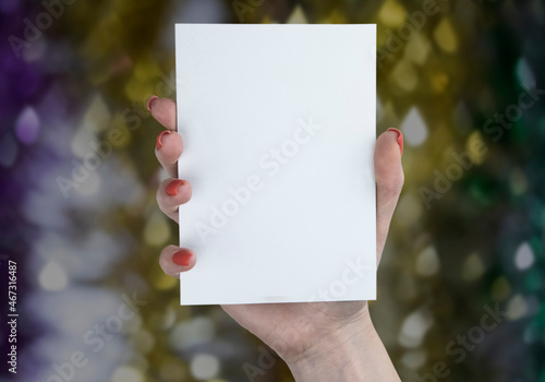 A woman holding white booklet © fontgraf