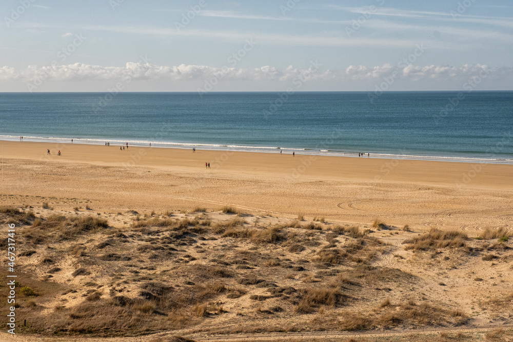 People walking in beach in Spain
