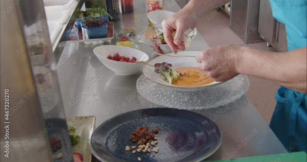 Professional chef preparing a tuna fish raw and other ingredients Professional chef preparing a tuna fish raw and other ingredients
