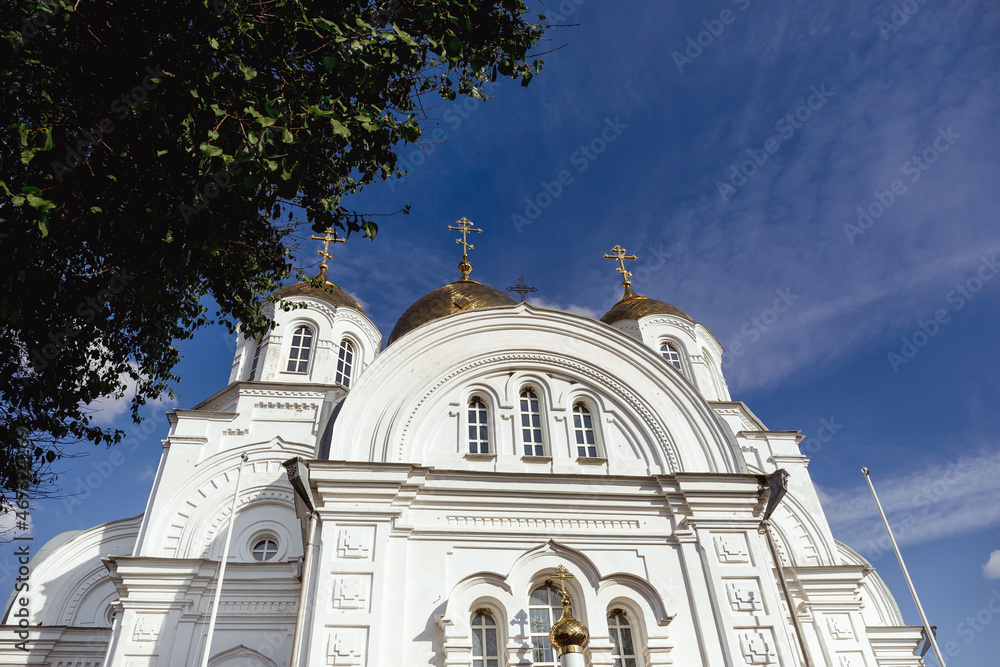 Orthodox Russian temple made of white stone against the sky