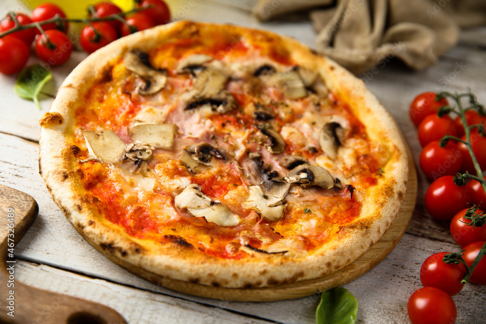 Traditional homemade pizza with mushroom and ham