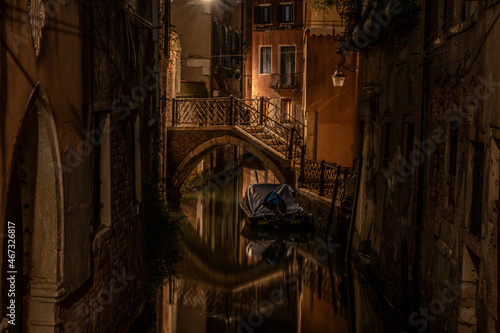 small walkway across a canal in Venice at night
