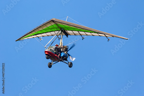 Flight on a motorized paraglider in mountainous terrain