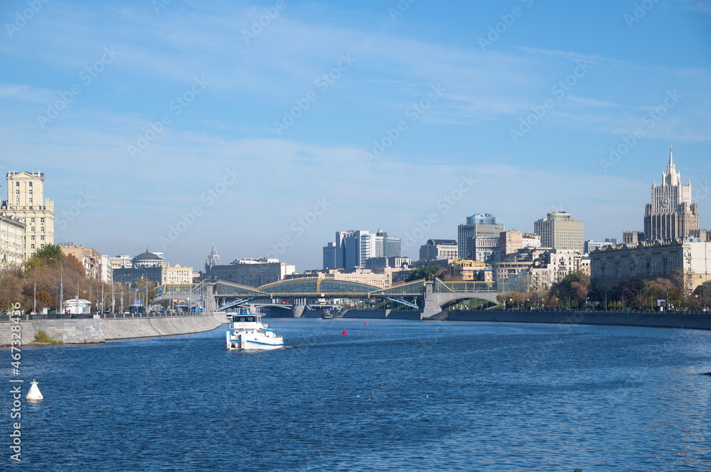 Moscow, Russia - October 9, 2021: View of the Bogdan Khmelnitsky Bridge, Berezhkovskaya and Rostovskaya embankments on an autumn sunny day