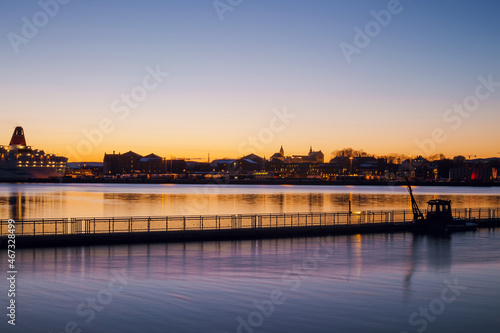 Scenic view of Oslo city coast with houses and buildings on twilight. Calm bay at dusk © WellStock