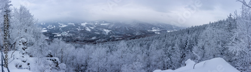 Winter snowy landscape in Jeseniky mountains from viewpoint of Medvedi Kamen. Panoramic view.