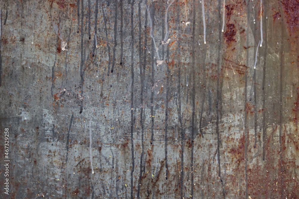 old rusty metal surface with gray and brown tones with dripping moisture grooves - rough weathered texture for a grunge background
